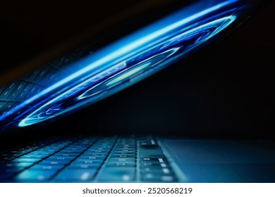 Futuristic Laptop with Blue Light Reflection - Powered by Shutterstock