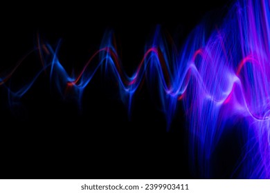 Futuristic light wave of energy with elegant glowing lines. Abstract technology background. High quality photo
