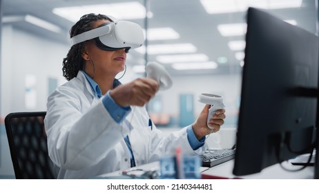 Futuristic Medical Hospital: Black Female Neurosurgeon Wearing Virtual Reality Headset Uses Controllers To Remotely Operate Patient Using Medical Robot. High-Tech Treatment Of Neurological Disease