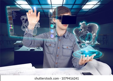 Futuristic medical scientist workplace. Male / man wearing shirt and vr glasses holding holographic prosthesis of coxal and touches virtual screen making medical analysis on futuristic background