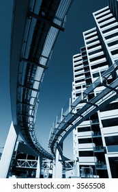 Futuristic Monorail Going Around Skyscrapers. Wide Angle View.