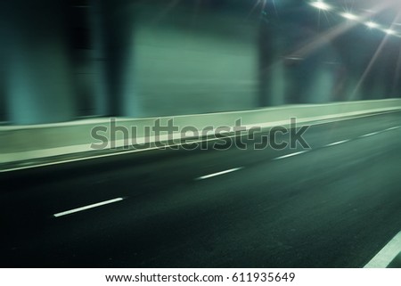futuristic motion blur road in tunnel, fast moving street background