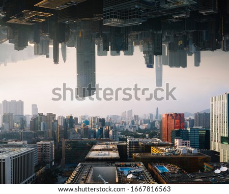 Futuristic multiverse world concept. Downtown with skyscrapers skyline under and cityscape over. Two parallel worlds. Alternative reality dimension