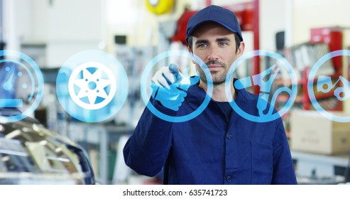 A Futuristic Portrait Of An Auto Mechanics Assistant, Works With A Hologram 24 Hours A Day, Buying, Selling And Repairing Spare Parts Online, In A Car Workshop. Concept: The Technology Of The Future.