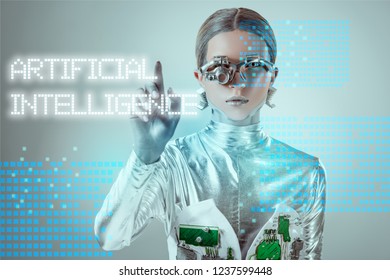 futuristic silver cyborg touching 