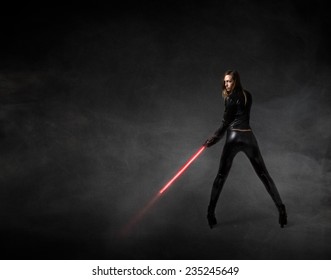 Futuristic Soldier With Red Laser Sword