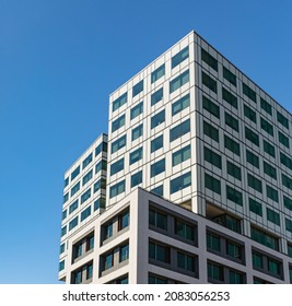 Futuristic square architecture of apartment building for real estate. Modern building exterior with modern architecture-Victoria BC, Canada. Street view, blurred, travel photo
