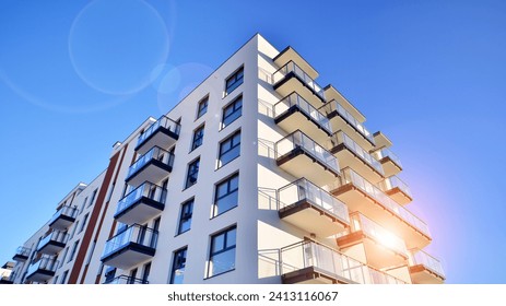 Futuristic square architecture of apartment building. Bottom view. Modern apartment building on a sunny day. Facade of a modern apartment building.  - Powered by Shutterstock