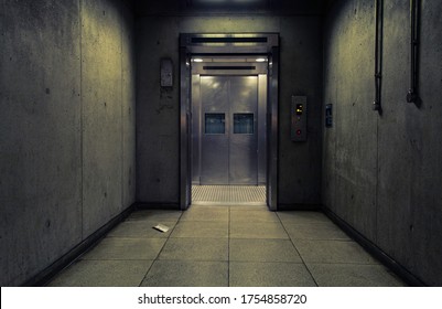 Futuristic Steel Elevator At The End Of A Concrete Corridor - Powered by Shutterstock