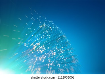 Futuristic technological background, closeup on the end of optical fiber network cable on blue background, space for your text