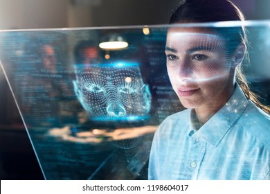 Futuristic And Technological Scanning Of The Face Of A Beautiful Business Woman For Facial Recognition. It Can Serve To Ensure Personal Safety At Work. 