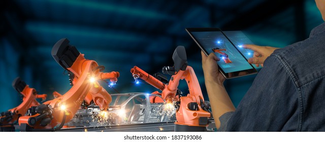 Futuristic technology trend concept of smart industry 4.0 engineer use artificial intelligence robotic automation machine in factory Connecting data network software to monitoring, operating process - Shutterstock ID 1837193086