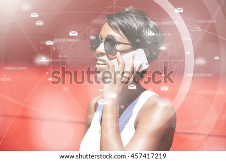 Futuristic technology. Visual effects. Profile of self-confident African woman with short pixie hairstyle wearing shades, holding electronic device at her ear, discussing business on mobile phone