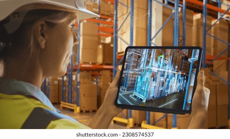 Futuristic Technology Warehouse: Female Worker Doing Inventory, Using Augmented Reality Application On Tablet. Woman Analyzes Digitalized Products Delivery Infographics in Distribution Center.