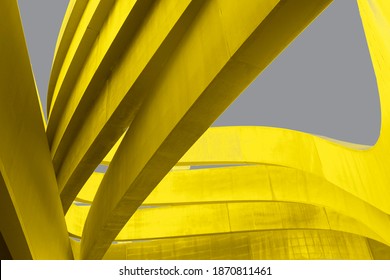 Futuristic urban backdrop. Art arch triangles made of metal in yellow color on grey background. Textured Bright yellow and grey abstract waved background. Trend Color 2021. Copy space