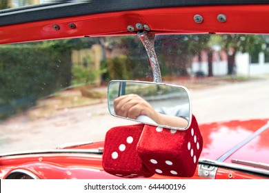 Fuzzy Red Dice Hang On Rear View Mirror On Havana Classic Car