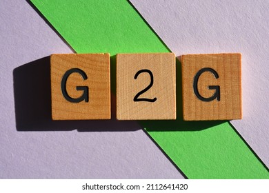 G2G, acronym, internet slang for Got To Go, in wooden alphabet letters isolated on background