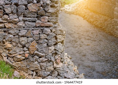 Gabion And Rock Armour - Coast And Waterways Protection. Gabion Walls Constructed Using Steel Wire Mesh Basket. Stone Wall, Gabion Revetment - Protection From Backshore Erosion