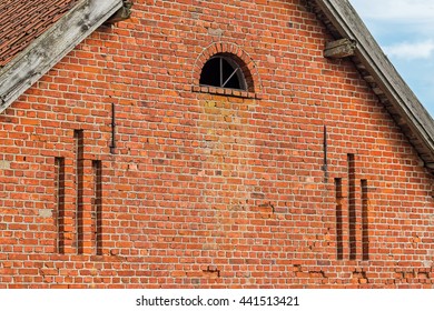 The gable of an ancient house of red brick