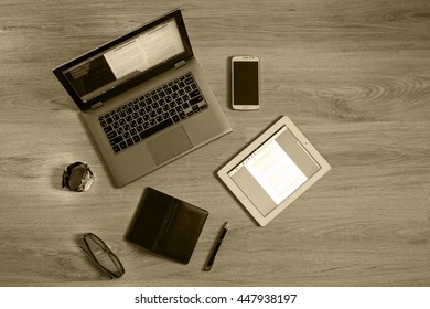 Gadgets and devices on the table : computer, pc, tablet, ipad, glasses, clocks, pen, phone, mobile, smartphone