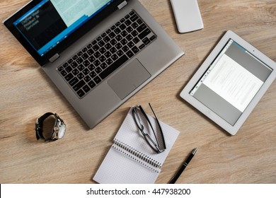 Gadgets and devices on the table : computer, pc, tablet, ipad, glasses, clocks, pen, phone, mobile, smartphone