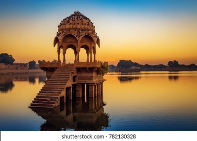 Gadi Sagar Lake Jaisalmer Rajasthan with ancient architecture at sunrise. A popular tourist destination in Rajasthan, India. - Powered by Shutterstock