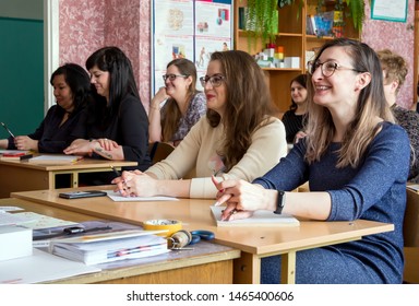 Gadjievo, Russia - April 13, 2019: Adults in school class sit at their desks.