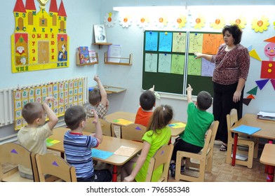 Gadjievo, Russia - January 9, 2011: The teacher deals with the children in the kindergarten