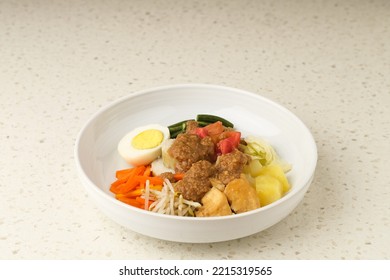 Gado Gado, Indonesian Traditional Vegetable Salad With Peanut Sauce, Rice Cake, Tofu And Egg
