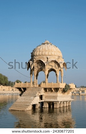 the Gadsisar Sagar Lake with historic buildings was built in 1367 by Maharaja Gadsi Singh to store rainwater and ensure a steady water supply for the city of Jaisalmer, India
