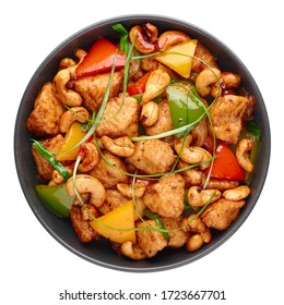 Gai Pad Med Mamuang Or Thai Cashew Chicken In Black Bowl Isolated On White. Kai Med Ma Muang Is Thai Cuisine Dish With Chicken Meat, Capsicum, Onion, Scallions, Chilli. Thai Food. Top View