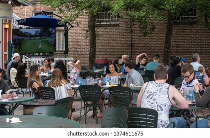 Gainesville, FL United States- 04/15/2019: Young People Enjoy An Outdoor Cafe Just Off The Campus Of The University Of Florida.