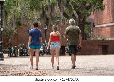 Gainesville, FL United States- 04/15/2019: An Incoming Freshman Tours The Campus Of The University Of FLorida With Her Parents.