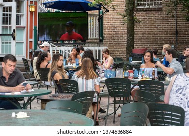 Gainesville, FL United States- 04/16/2019: College Students Enjoy An Outdoor Cafe Near The Campus Of UF.