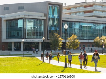 GAINESVILLE, FLORIDA - NOVEMBER 18, 2019:  Students Walk Outside On The Quad Lawn Of The University Of Florida College Campus In Gainesville