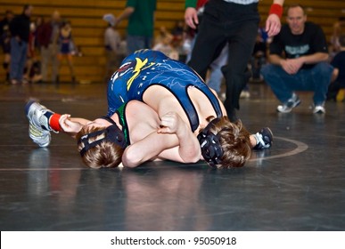 GAINESVILLE, GA, USA - FEB 11: Andy Leggett, The Winner, Pins An Unidentified Opponent In The 11-14 Division Of A Wrestling Tournament, February, 11, 2012, North Hall High School In Gainesville, GA.