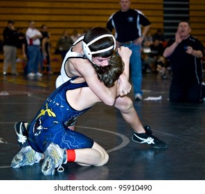 GAINESVILLE, GA, USA - FEB 11: Andy Leggett, Winner, Is Held By An Unidentified Boy In The 11-14 Division Of A Wrestling Tournament, February, 11, 2012, At North Hall High School In Gainesville, GA.