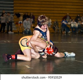 GAINESVILLE, GA, USA - FEB 11: Andy Leggett Holding An Unidentified Boy Who Won, In The 11-14 Division Of A Wrestling Tournament, February, 11, 2012, At North Hall High School In Gainesville, GA.