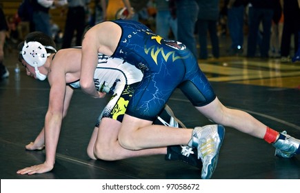 GAINESVILLE, GA, USA - FEB 11: Andy Leggett, Winner, Holding An Unidentified Boy In The 11-14 Division Of A Wrestling Tournament, February, 11, 2012, At North Hall High School In Gainesville, GA.