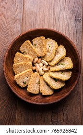 Gajak or til papdi or patti is a dry sweet cake - made of sesame seeds, ground nuts and jaggery, consumed in indian winter especially during Makar Sankranti festival on 14th january
