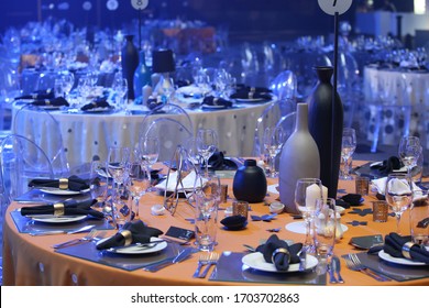 Gala tables set up with blue lighting