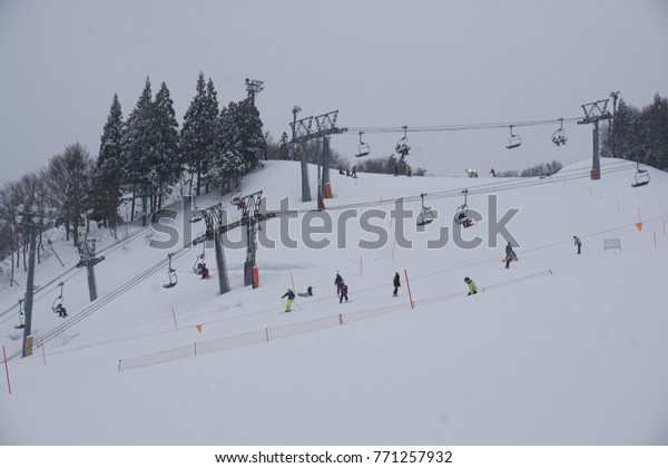 GALA YUZAWA, JAPAN MARCH 16, 2560\
: Tourists are skiing on blizzard day at Gala Yuzawa,\
JAPAN.