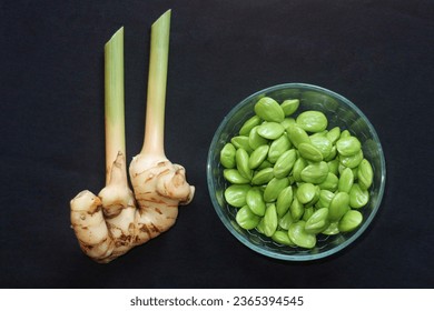Galangal and fresh pete, both are the same food ingredients, especially Indonesian food and have the same distinctive smell or aroma. - Shutterstock ID 2365394545