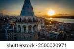 Galata tower. Close-up photo of Galata Tower, one of the few beauties of Istanbul, taken with a drone at sunset. Magnificent view of the sea and buildings in the background.