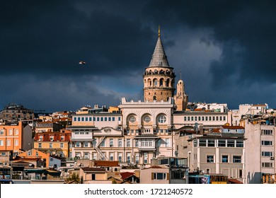 The Galata tower and the old quarters of Istanbul on the background of dark sky. Istanbul before the storm. Tourist destination Istanbul Turkey - Powered by Shutterstock