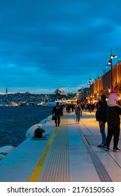 Galataport Istanbul At Night. People Walking On The Deck Of Galataport. Istanbul Turkey - 12.28.2021