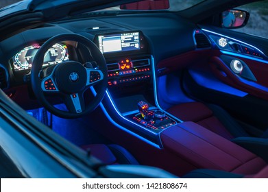 Galati, Romania - April 28, 2019: BMW 850i G14 xDrive Steptronic interior lights at night. Dashboard, navigation and ambiental lights