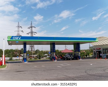 GALATI, ROMANIA - SEPTEMBER 10, 2015. OMV gas station with fueling car. OMV was founded in 1956 and is Austria's largest oil industry company.