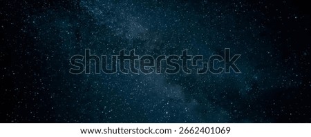 Galaxy exploration through outer space towards glowing milky way galaxy. High quality, beautiful night sky time lapse with Milky Way galaxy on dark sky. Starry night background.