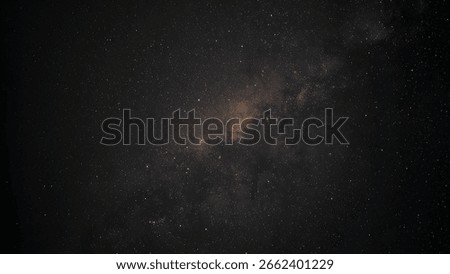 Galaxy exploration through outer space towards glowing milky way galaxy. High quality, beautiful night sky time lapse with Milky Way galaxy on dark sky. Starry night background.